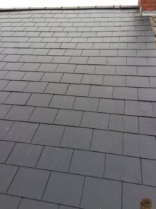 removal of old slate roof supplied and fitted a composite slate. new dry ridge 15