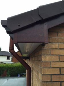 rosewood fascia with white and rosewood soffit new gutters and dry verge 13 13